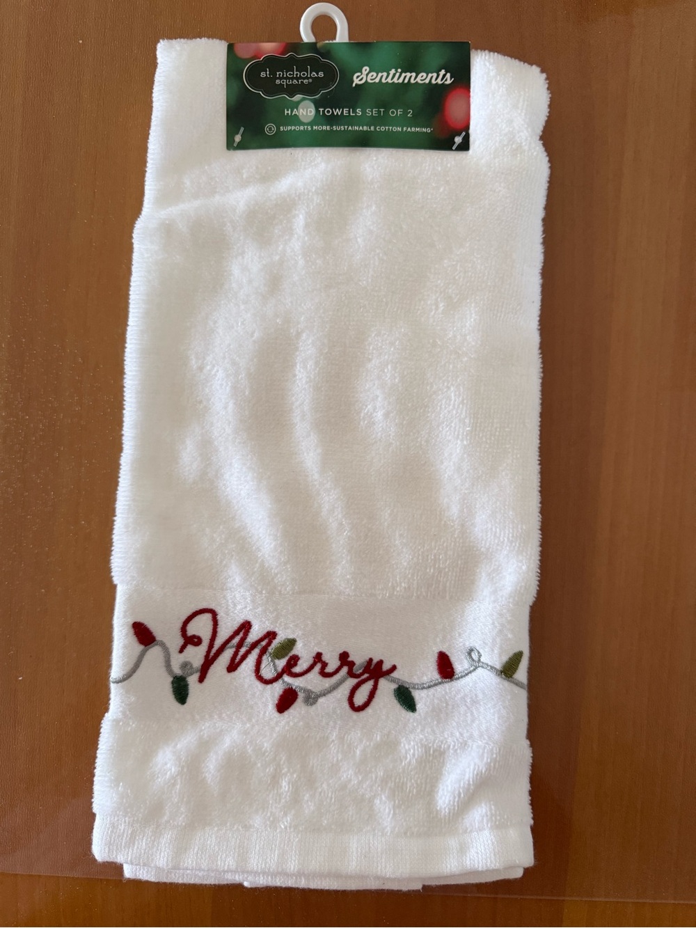 St. Nicholas Square White Hand Towel with Red & Green 'Merry' Embroidery